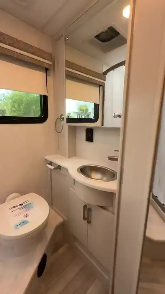 The bathroom with vanity and sink