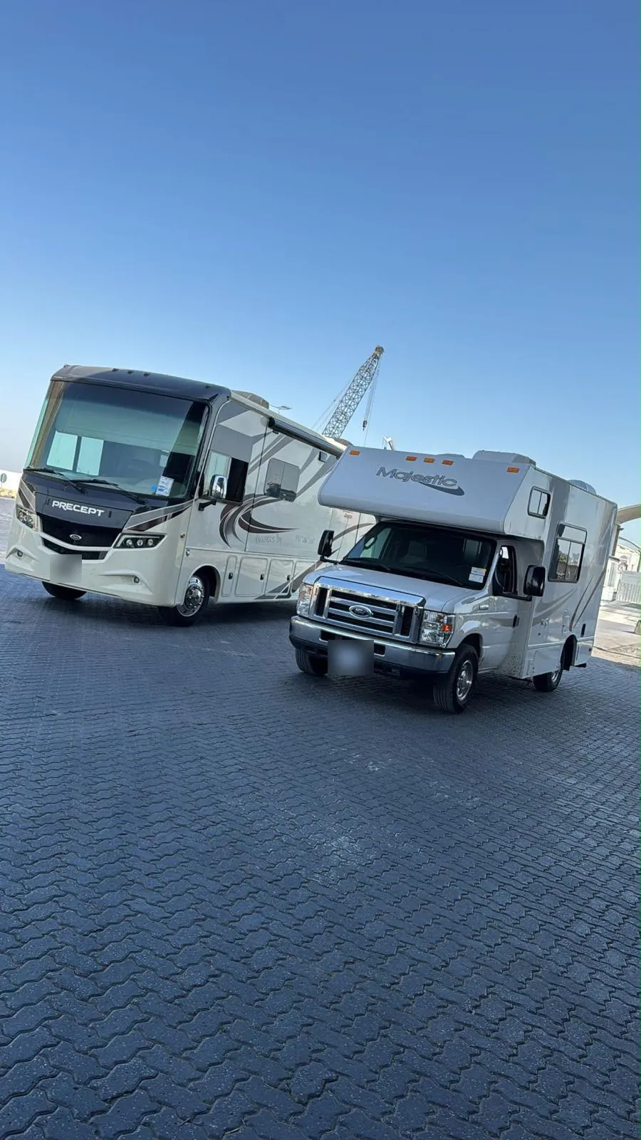 Two American motorhomes parked together after arriving in the Gulf